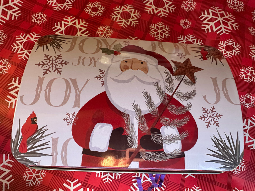 Decorative tray with Santa Claus design and 'Joy' text on a red snowflake patterned background